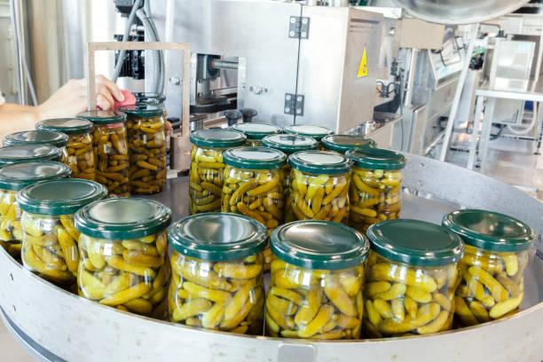 factory production of pickles in jars